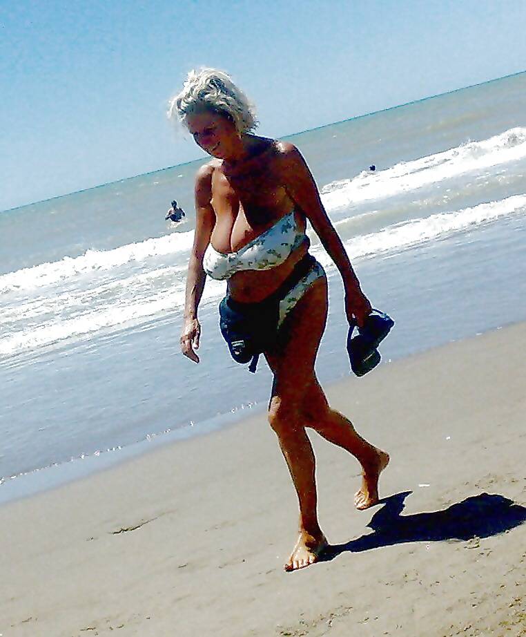 Old ladies with big tits in a swimsuit on the beach